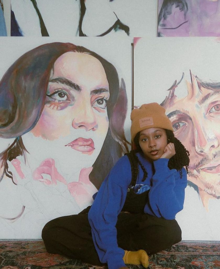 Lily Parker painting in her studio